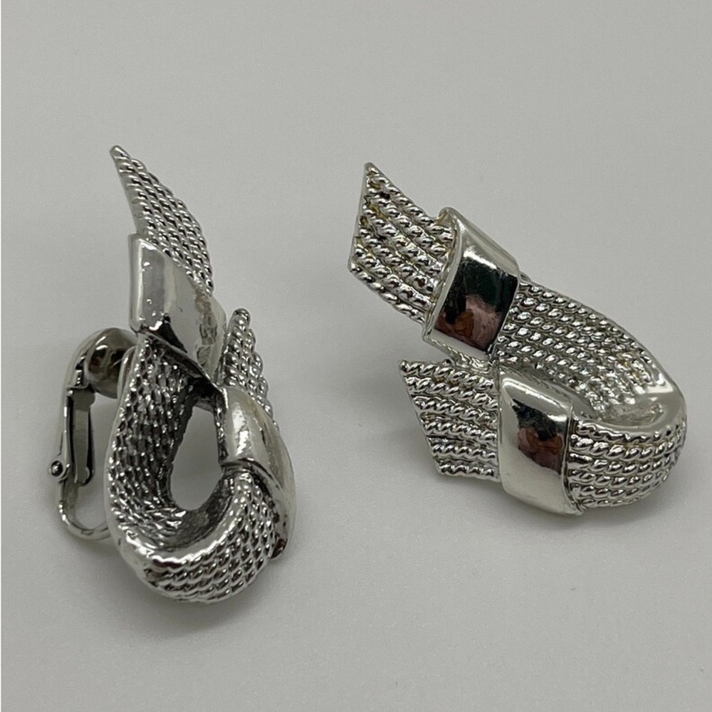 A Pair of Silver-Tone Clip-On Coro Signed Ribbon Earrings